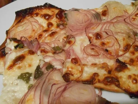 Recette de la tarte duo courgettes-oignons au chèvre